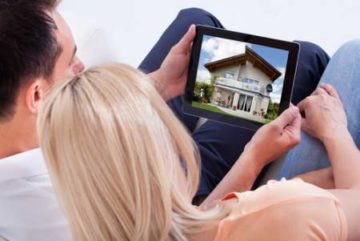 couple looking at homes for sale online