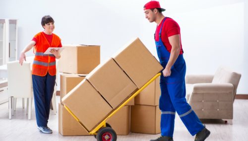 woman and man moving boxes