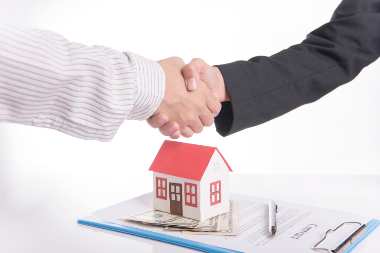 home warranty - shaking hands over contract